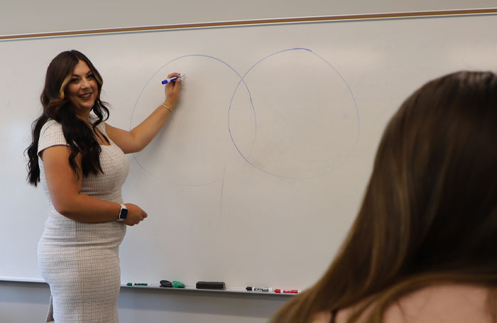 Woman teaching the basics of homebuying in a class for home buying basics